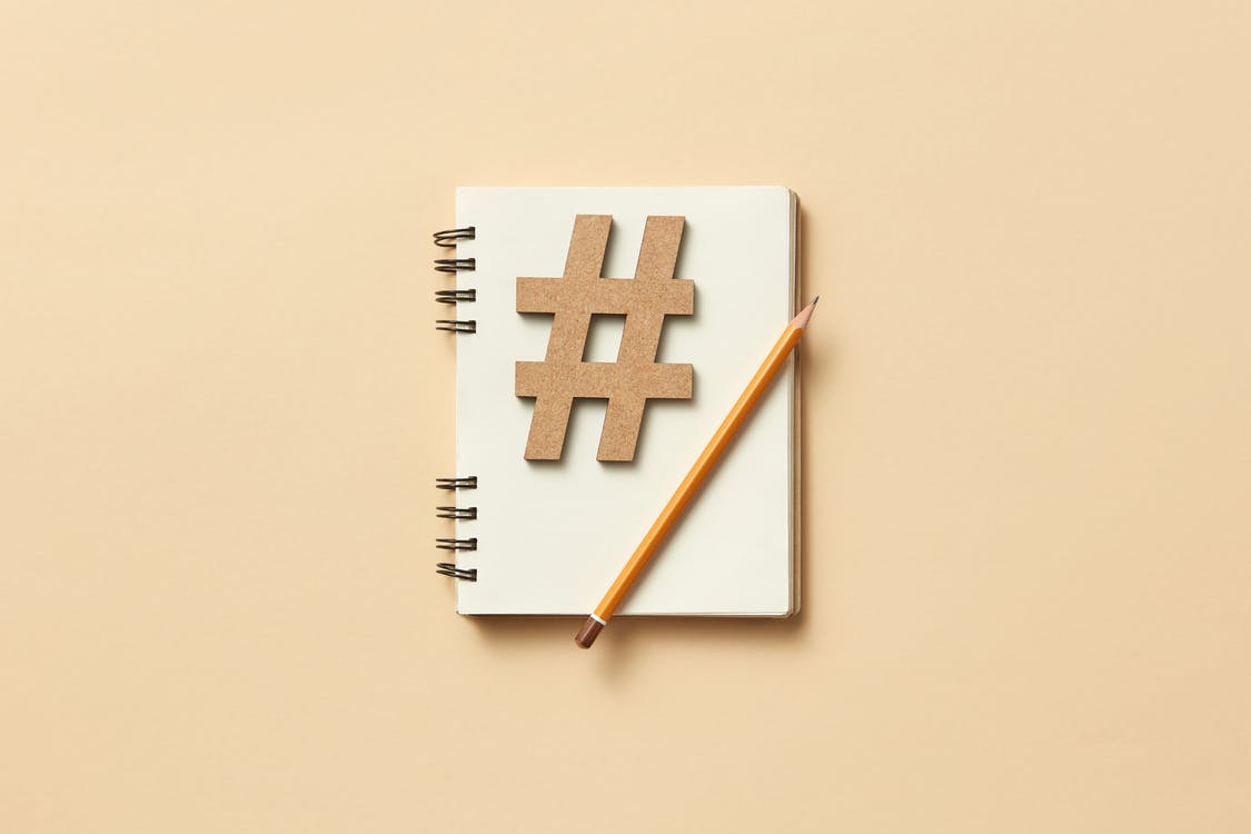 Free Pencil on a Notebook  Stock Photo
