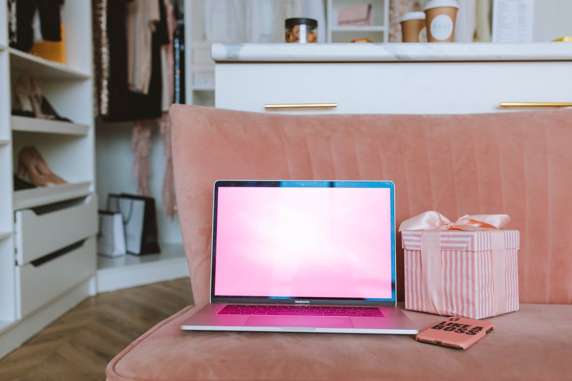 Free Macbook beside Pink Gift Box Stock Photo
