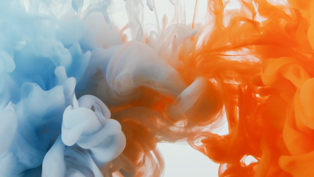 Liquid Reaction in Mixing Orange and Blue Paints  
